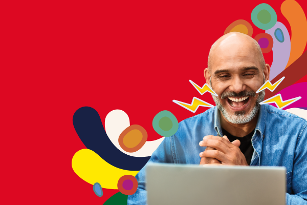 Man smiling at laptop